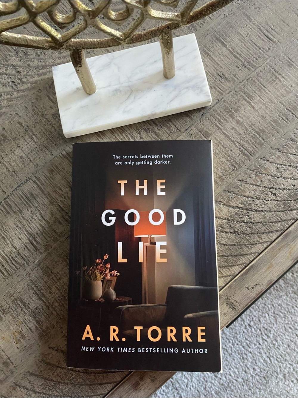 "The Good Lie" Paperback Book - Black Cover